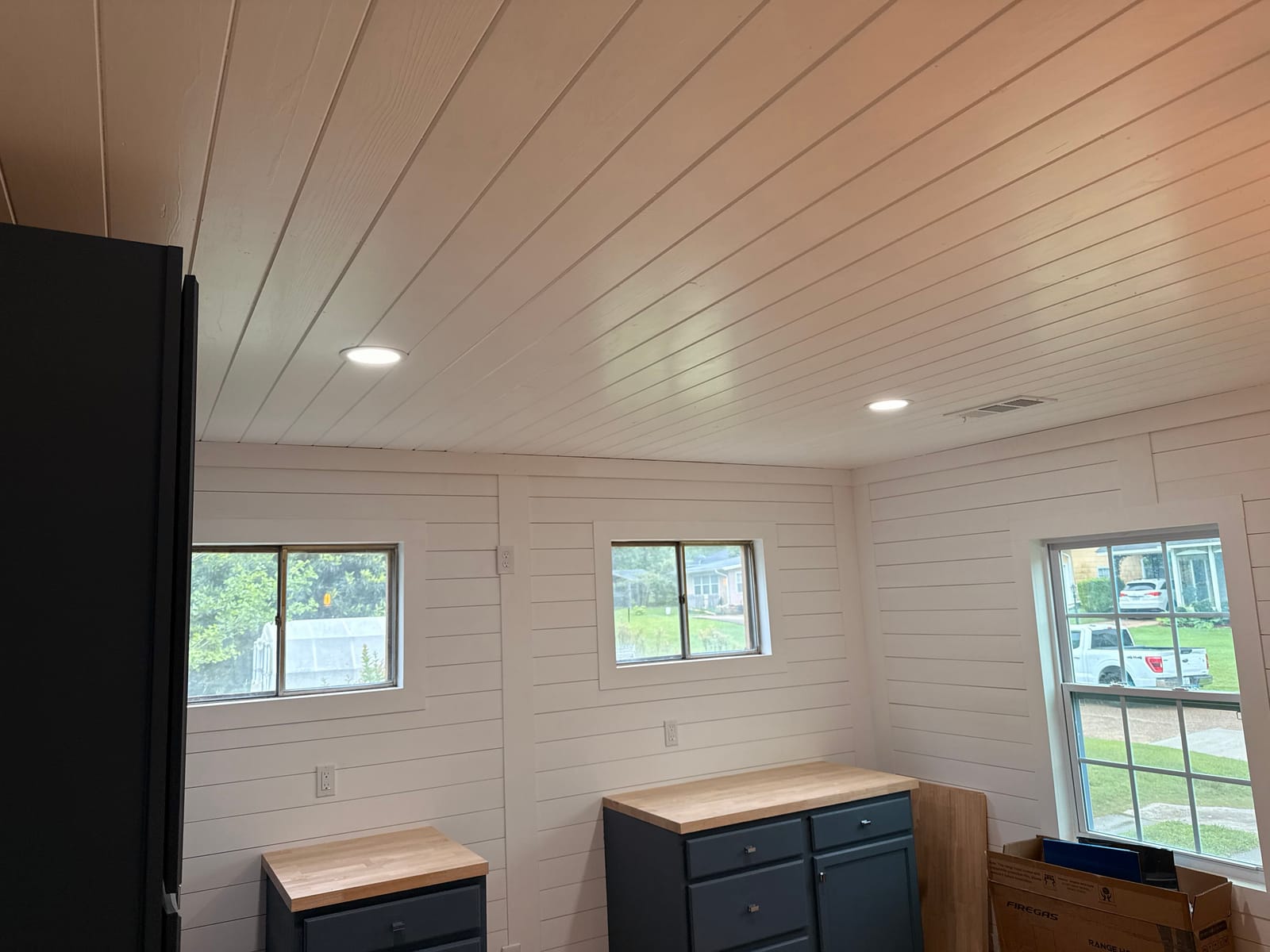 Recessed ceiling lights and wall receptacles in a freshly finished interior